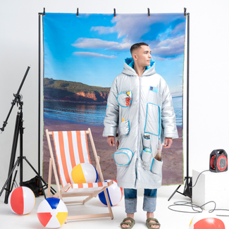 Aldi Cooler Coat modelled on a beach set