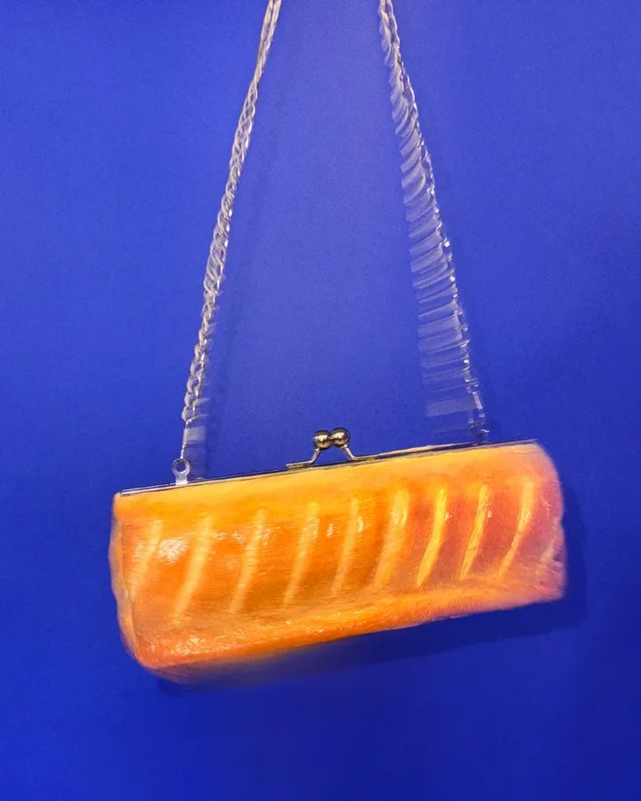 Gregg's Sausage Roll Clutch bag styled as a high-fashion accessory by The Robin Collective