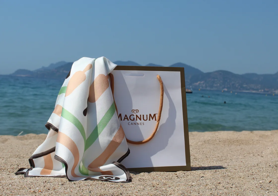 Magnum Cannes bespoke silk scarf and branded bag on the beach - designed and produced by The Robin Collective