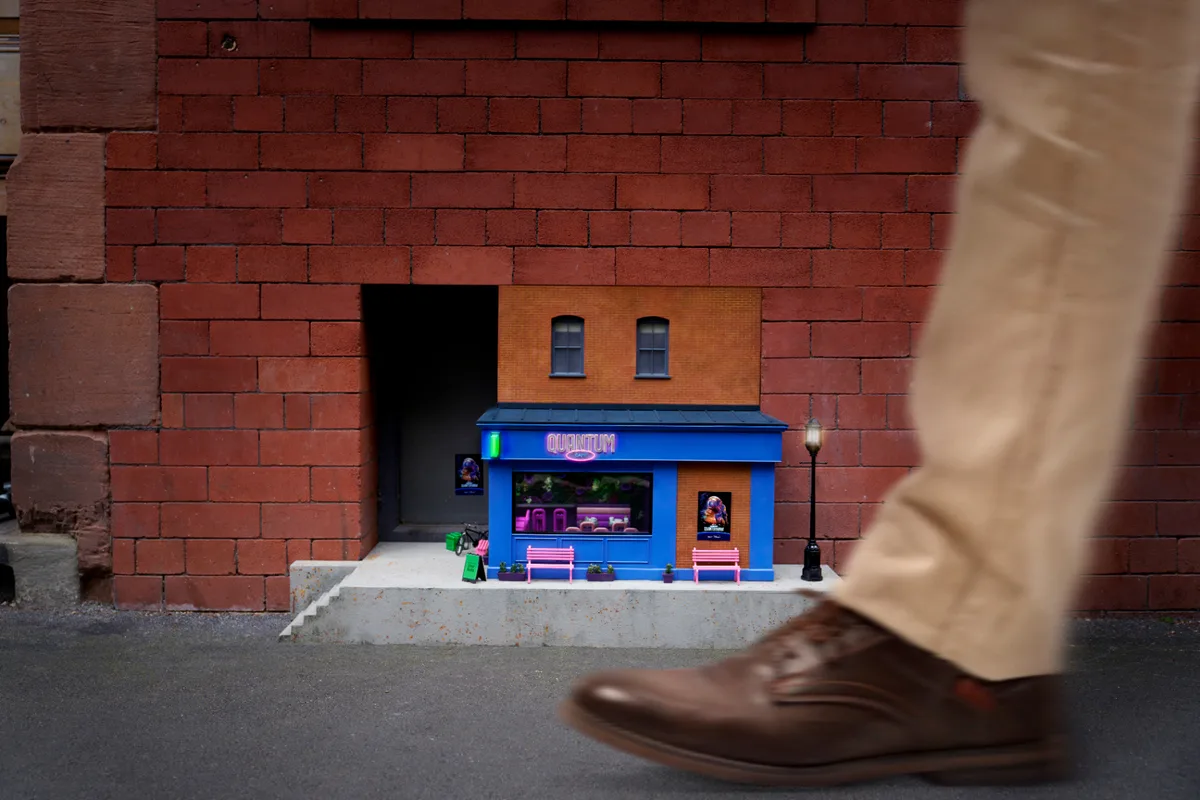 Miniature Quantum Cafe storefront installed in a brick wall as part of the Ant-Man x Uber Eats activation