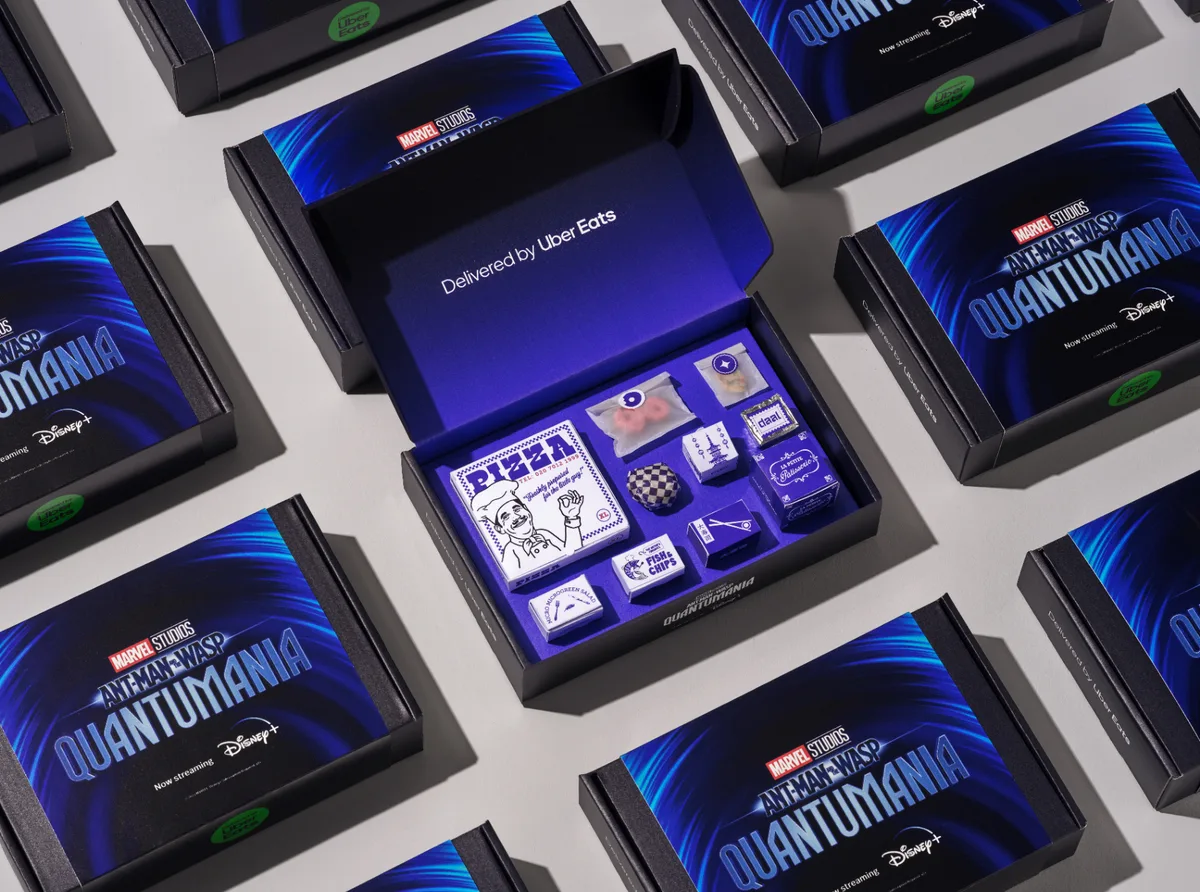 Ant-Man x Uber Eats Quantumania-branded influencer delivery boxes opened to reveal miniature takeaways